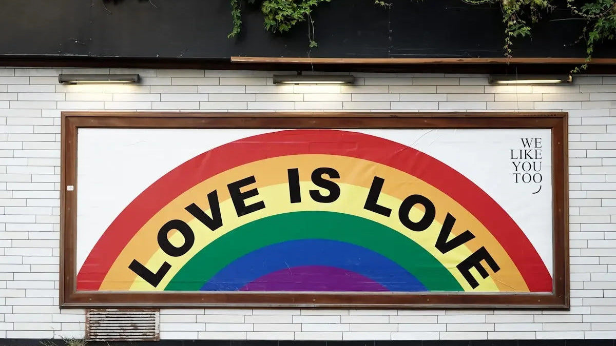 love is love wall art with brown wooden frame