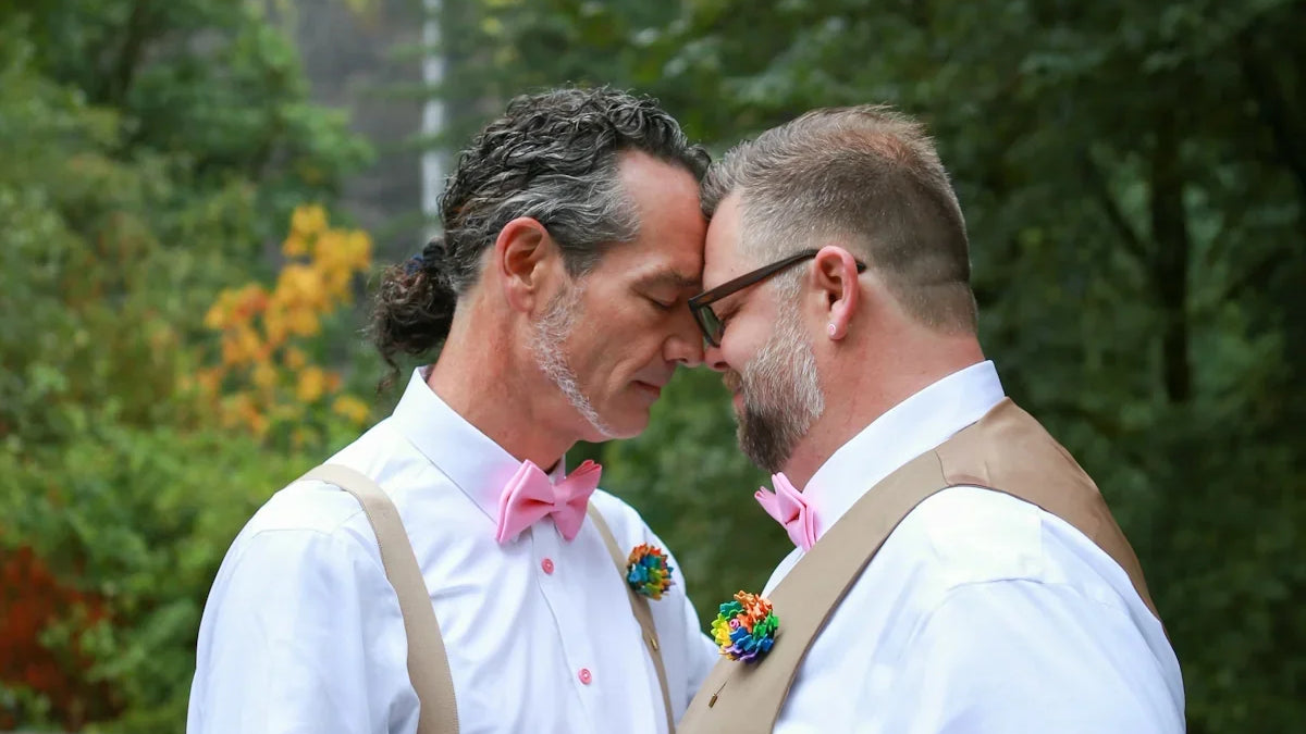 a couple of men kissing