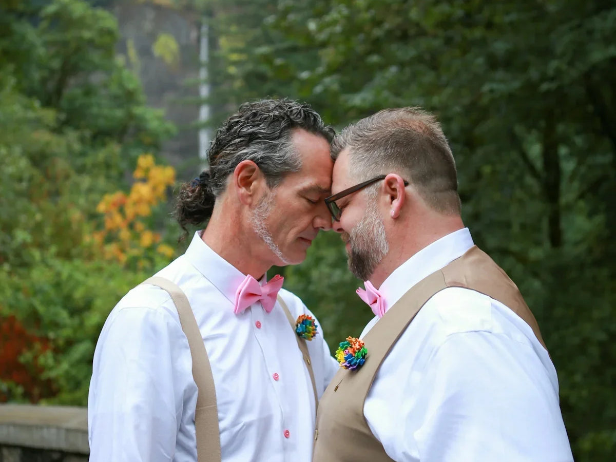 a couple of men kissing